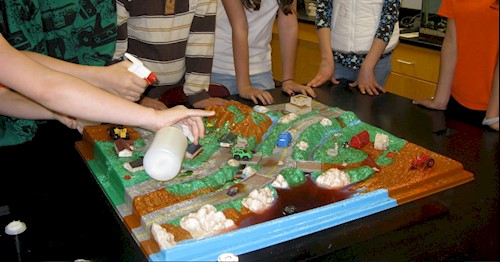 A photo of the enviroscape model featuring hills and waterbodies. 